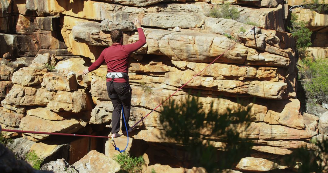 Person Practicing Slacklining On Mountain Cliff In Nature - Free Images, Stock Photos and Pictures on Pikwizard.com