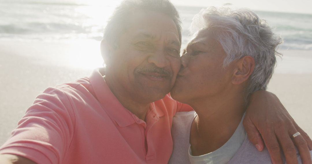 Happy Senior Couple Enjoy Beach Selfie at Sunset