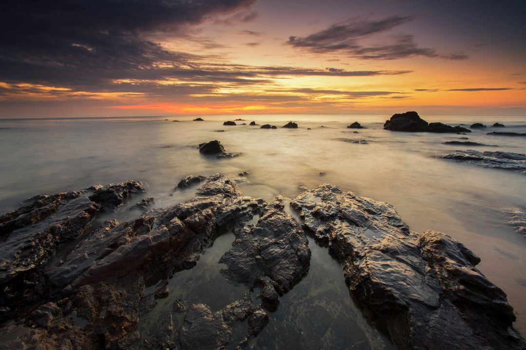 Dramatic Rocky Seashore at Sunset - Free Images, Stock Photos and Pictures on Pikwizard.com
