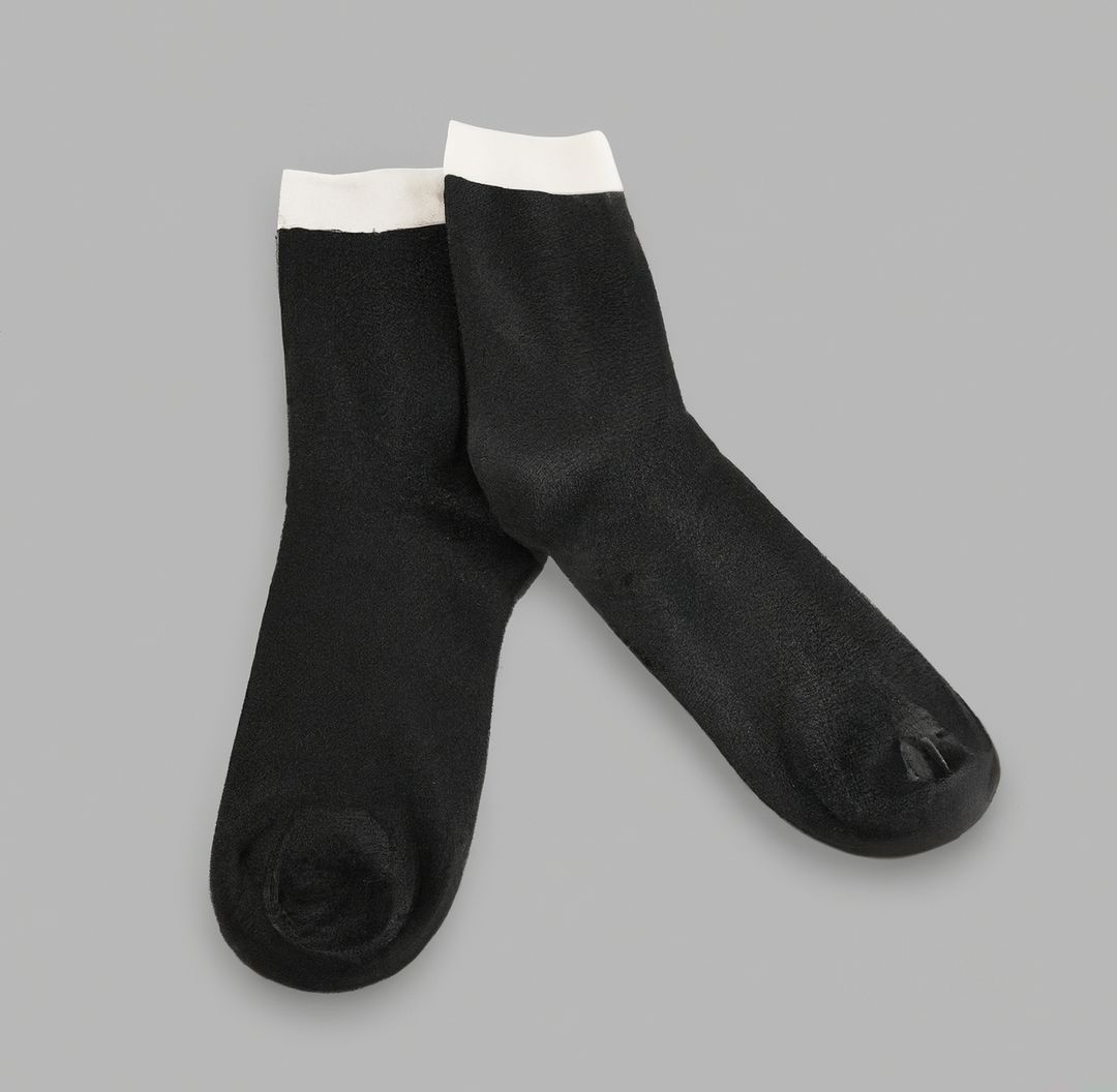 Pair of Cozy Black Socks on Gray Background - Free Images, Stock Photos and Pictures on Pikwizard.com