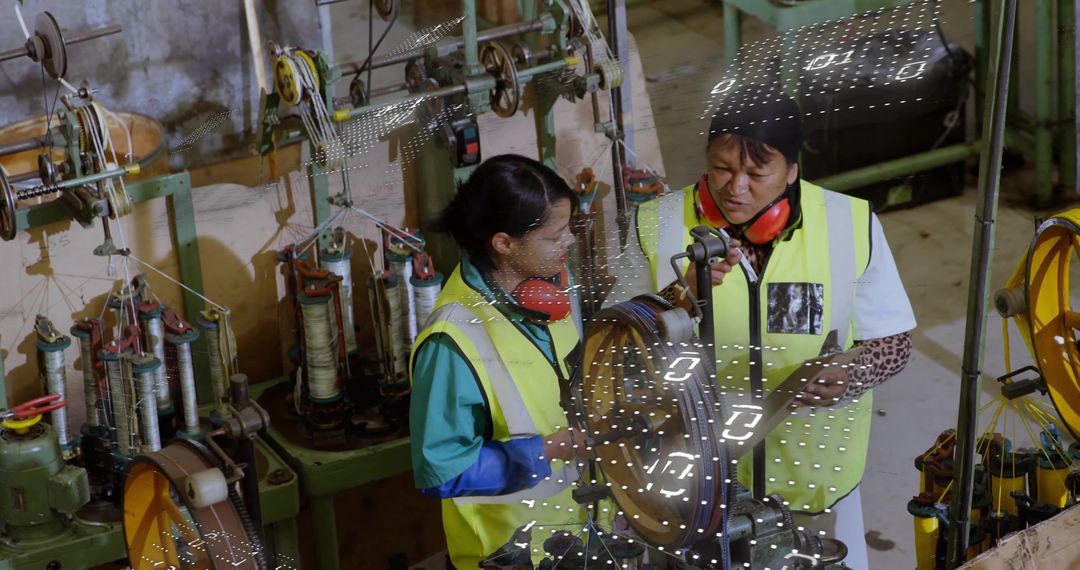 Operators Using Protective Gear at Industrial Cable Winding Station