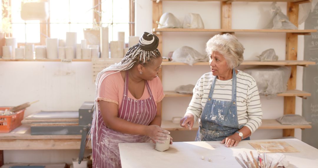 Diverse Women Engaged in Pottery Lesson - Free Images, Stock Photos and Pictures on Pikwizard.com