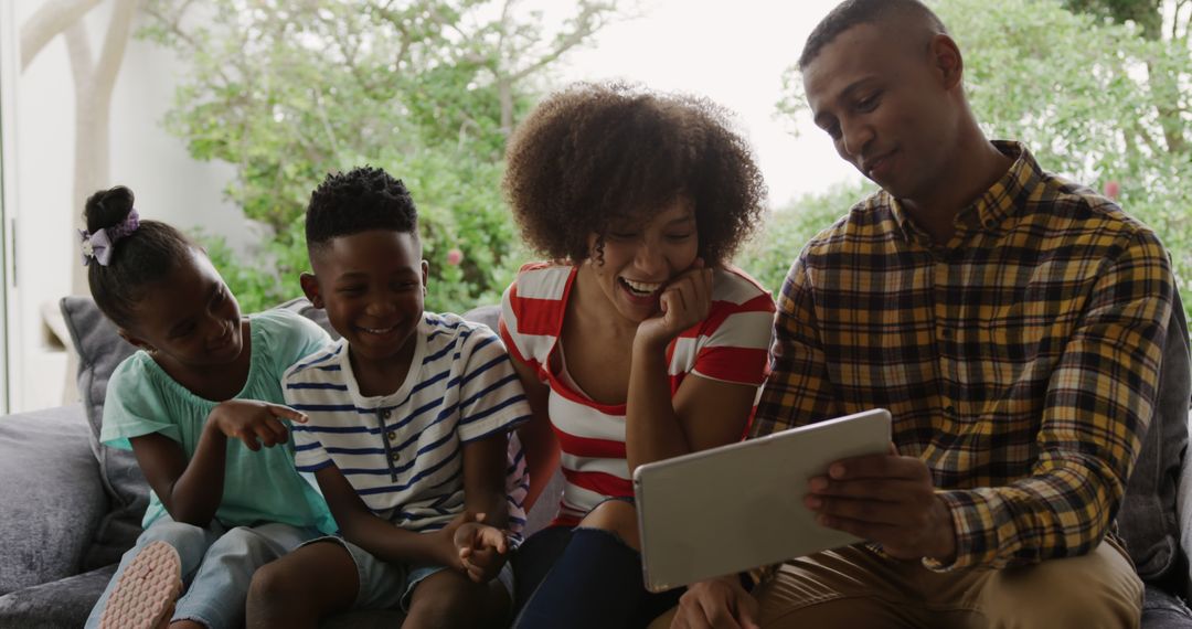 Diverse Family Enjoying Quality Time with Tablet