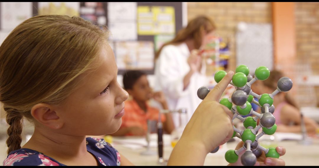 Curious Girl Exploring Molecular Model in Science Class - Free Images, Stock Photos and Pictures on Pikwizard.com