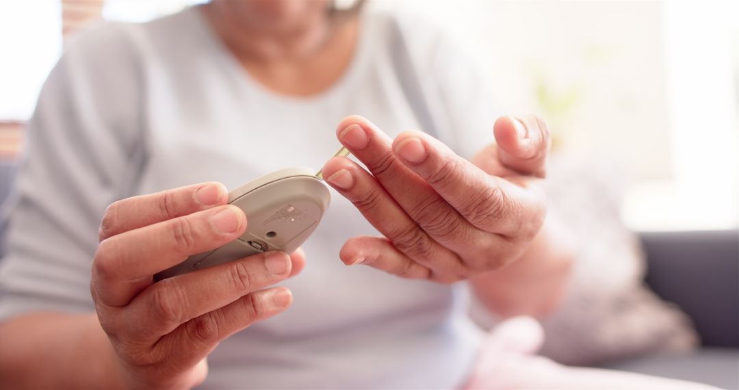Senior Patient Using Glucometer for Blood Sugar Monitoring at Home