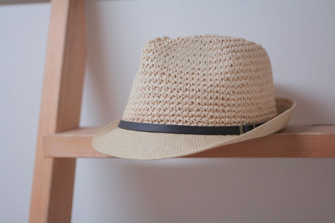 Stylish Brown Woven Fedora Hat on Wooden Shelf - Free Images, Stock Photos and Pictures on Pikwizard.com
