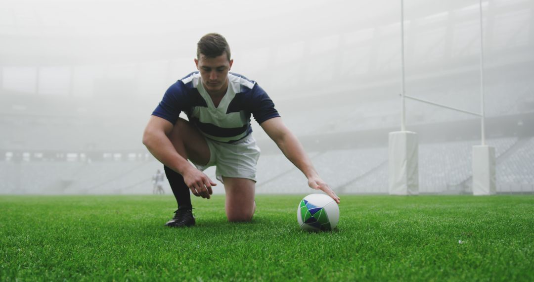 Rugby Player Preparing to Kick Ball in Stadium - Free Images, Stock Photos and Pictures on Pikwizard.com