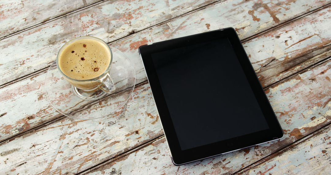 Tablet and Coffee on Rustic Wooden Table - Free Images, Stock Photos and Pictures on Pikwizard.com