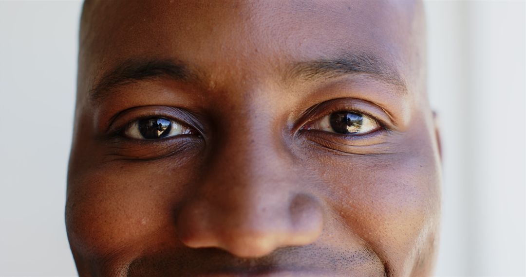 Close-Up Portrait of Smiling Man with Warm Expressions