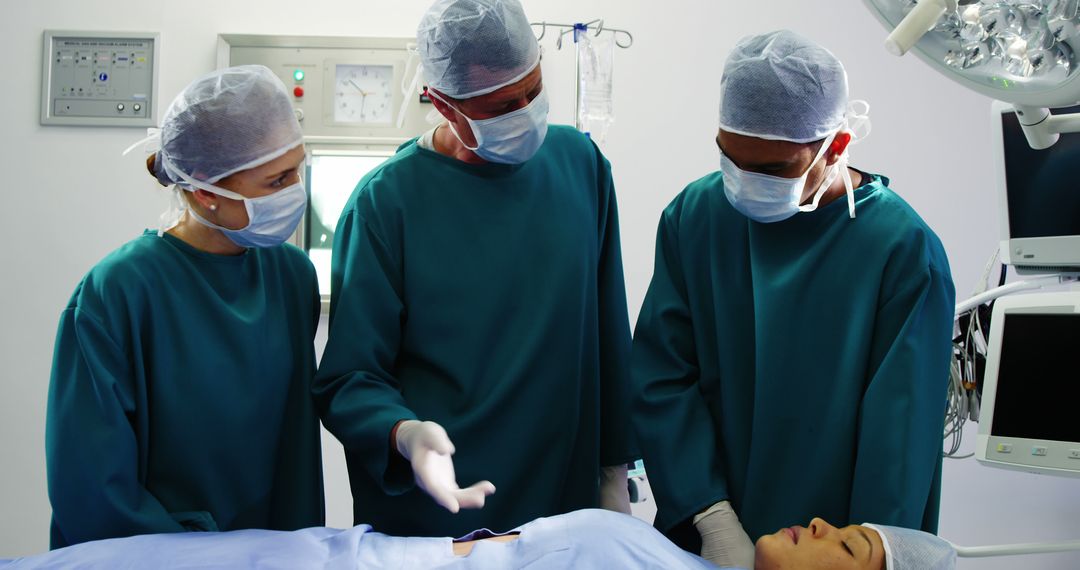 Team of Surgeons Preparing for Surgery in Operating Room - Free Images, Stock Photos and Pictures on Pikwizard.com