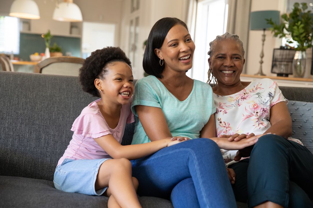 Smiling African American Family Enjoying Time Together on Couch