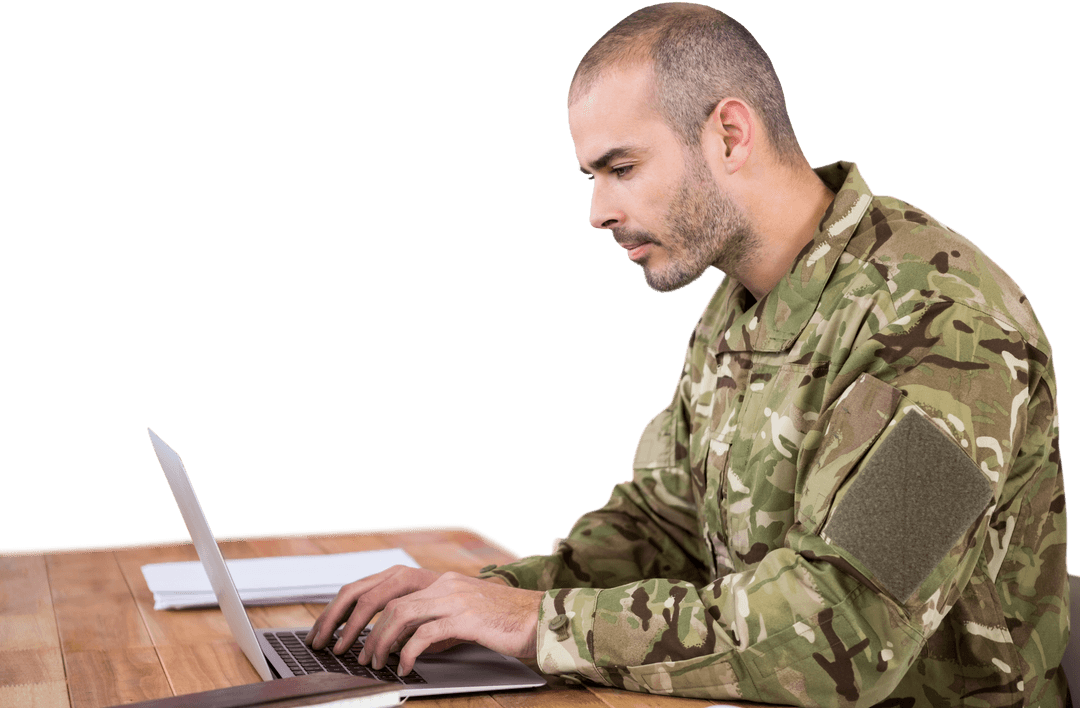 Transparent Military Soldier Using Laptop at Wooden Desk