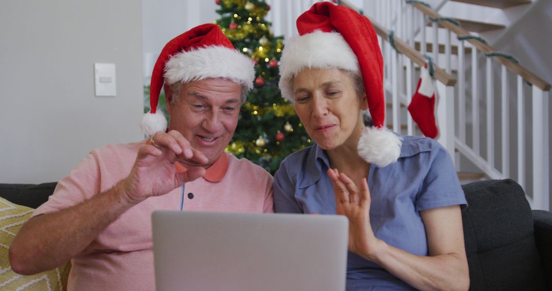 Senior Couple Enjoying Christmas Virtual Call on Laptop - Free Images, Stock Photos and Pictures on Pikwizard.com