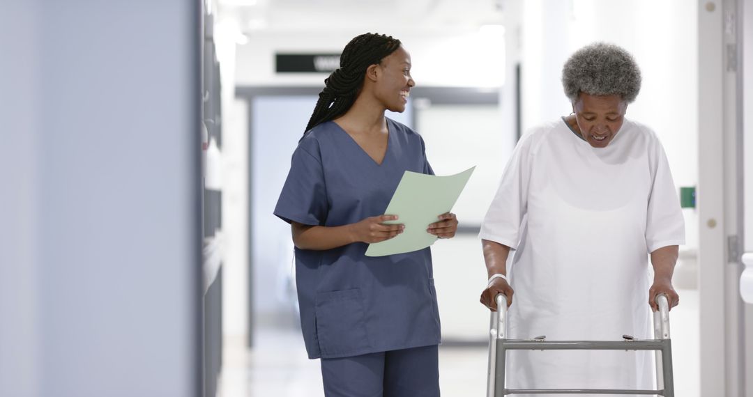 Nurse Assisting Elderly Woman with Walker in Hospital Corridor - Free Images, Stock Photos and Pictures on Pikwizard.com