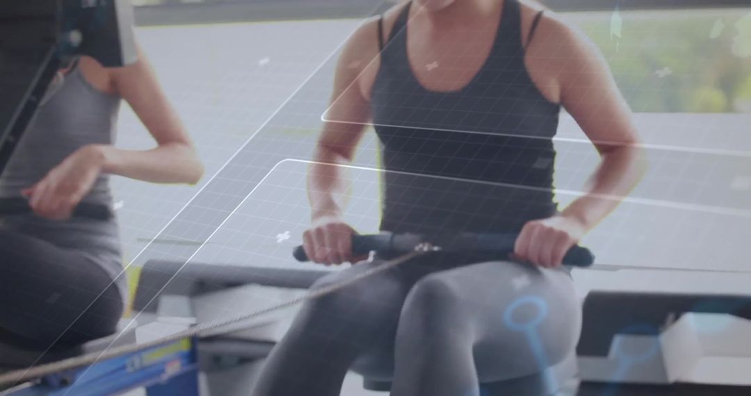 Fitness Enthusiasts on Rowing Machines with Digital Analytics
