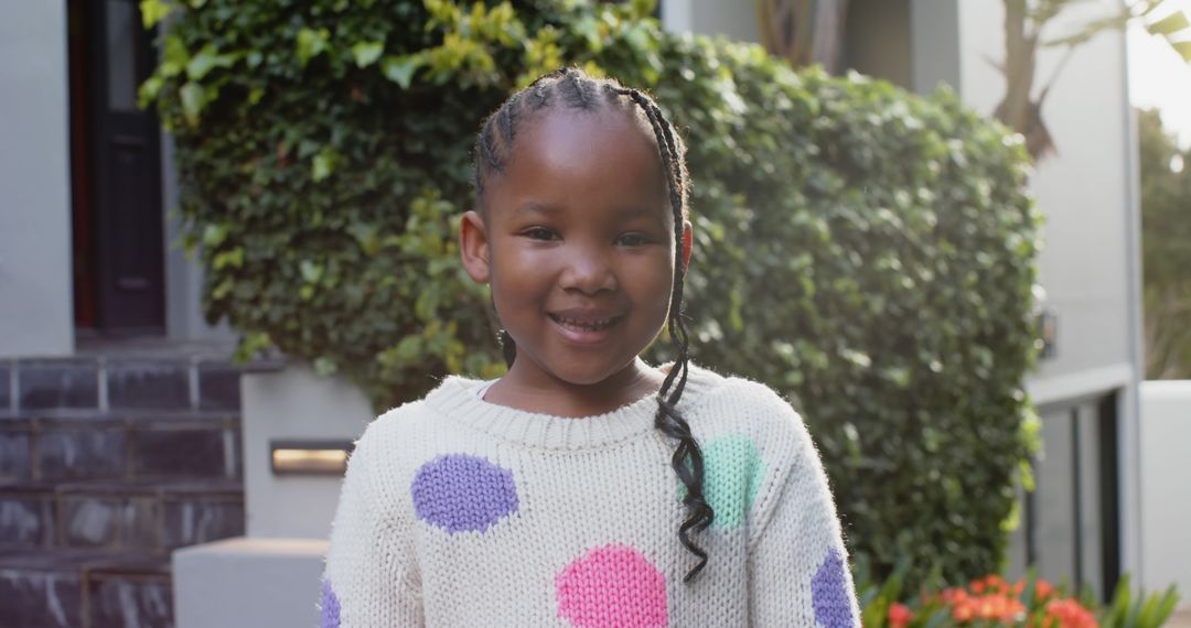 Smiling Child in Polka Dot Sweater Outdoors - Free Images, Stock Photos and Pictures on Pikwizard.com