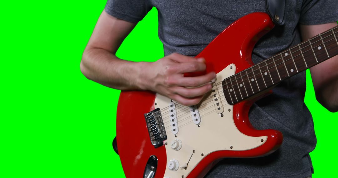 Playing Electric Guitar on Green Screen Background - Free Images, Stock Photos and Pictures on Pikwizard.com