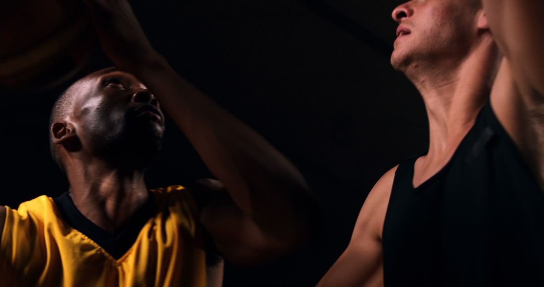 Intense Basketball Action Between Two Players on Court