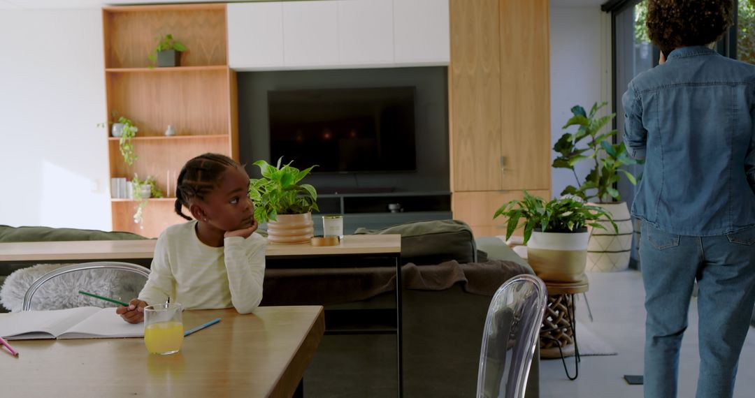 Daughter Doing Homework with Mother at Home