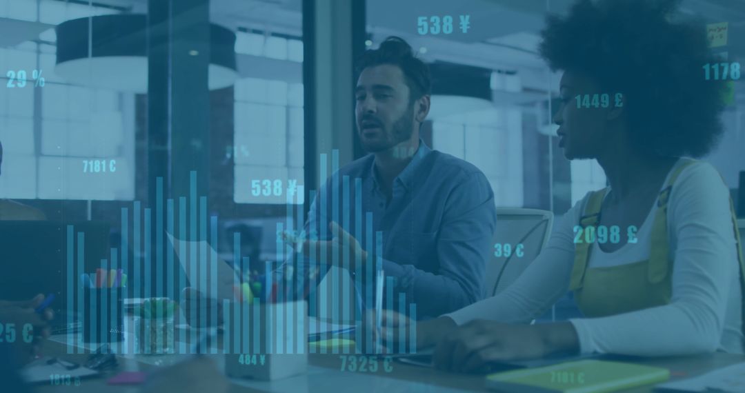 Diverse Business Team Analyzing Financial Data Charts in Modern Office