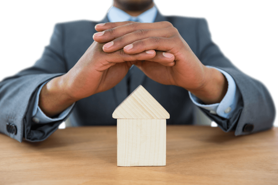 Transparent Businessman Protecting Wooden House Model