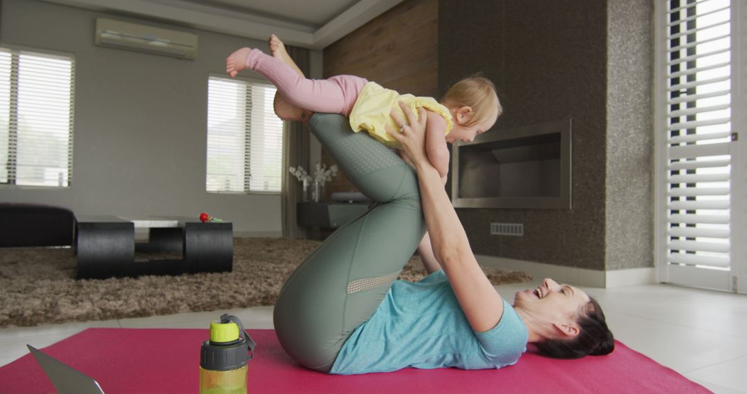 Mother Practicing Yoga with Baby at Home