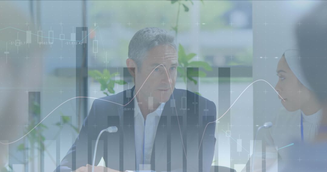 Business Team Analyzing Data with Transparent Charts Overlay