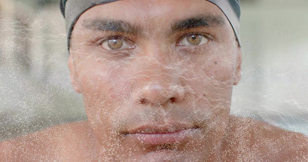 Gazing Swimmer Wearing Swim Cap Through Water Droplets Closeup Showing Focus and Strength