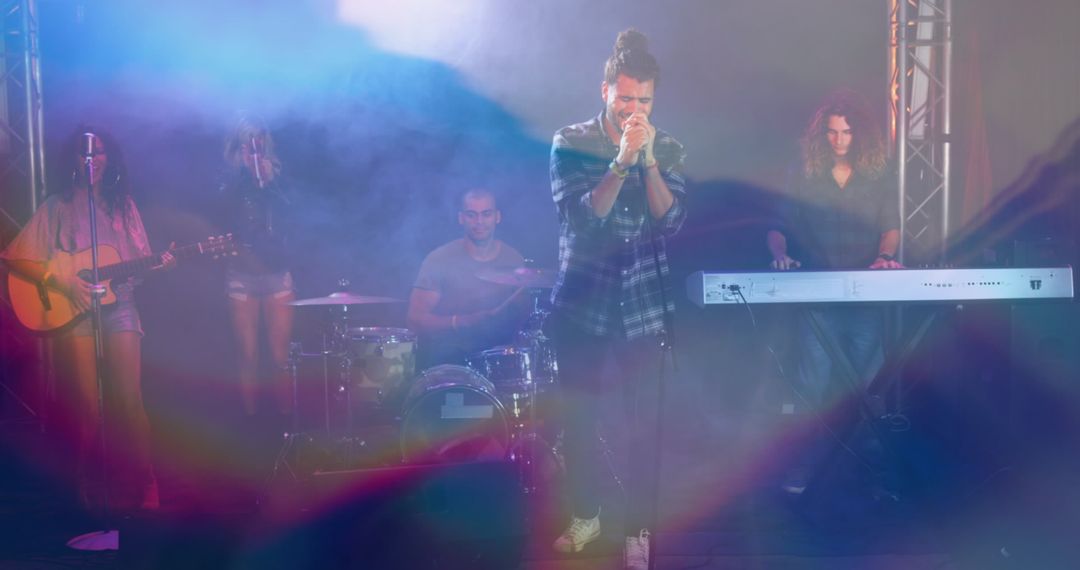 Passionate Band Performance with Vibrant Lights on Stage