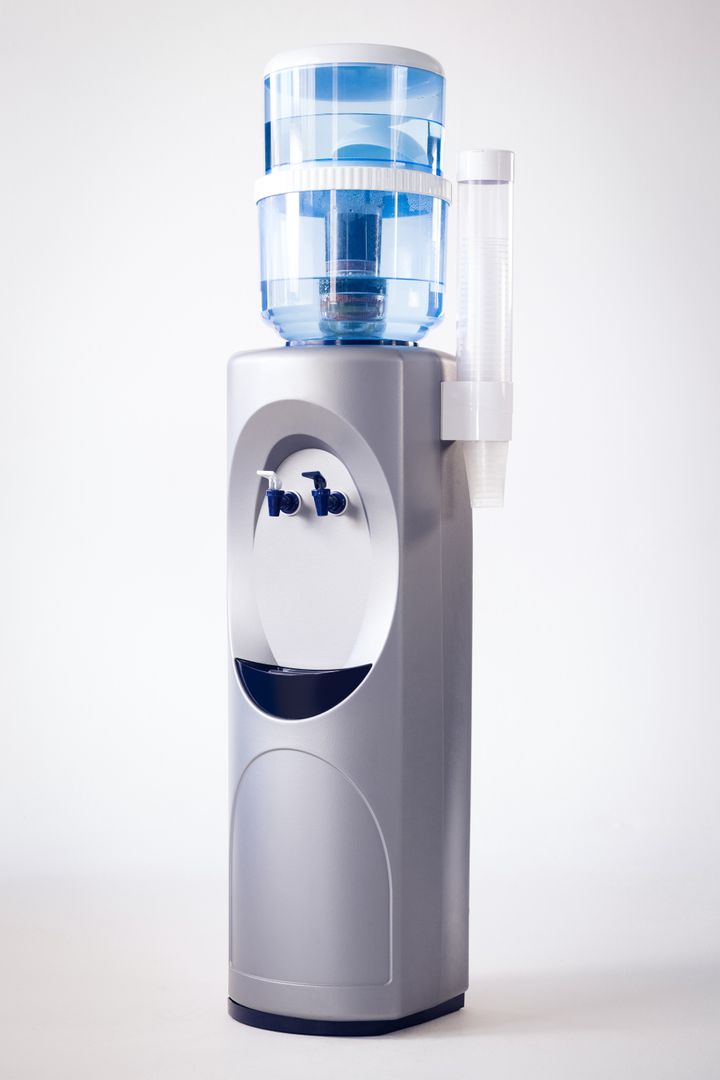 Modern Water Dispenser with Blue Water Bottle - Free Images, Stock Photos and Pictures on Pikwizard.com