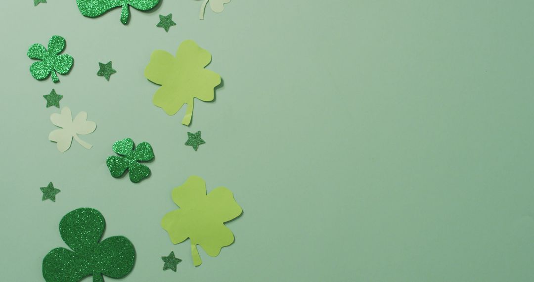 Green Shamrocks with Glitter Stars on Pastel Green Background - Free Images, Stock Photos and Pictures on Pikwizard.com