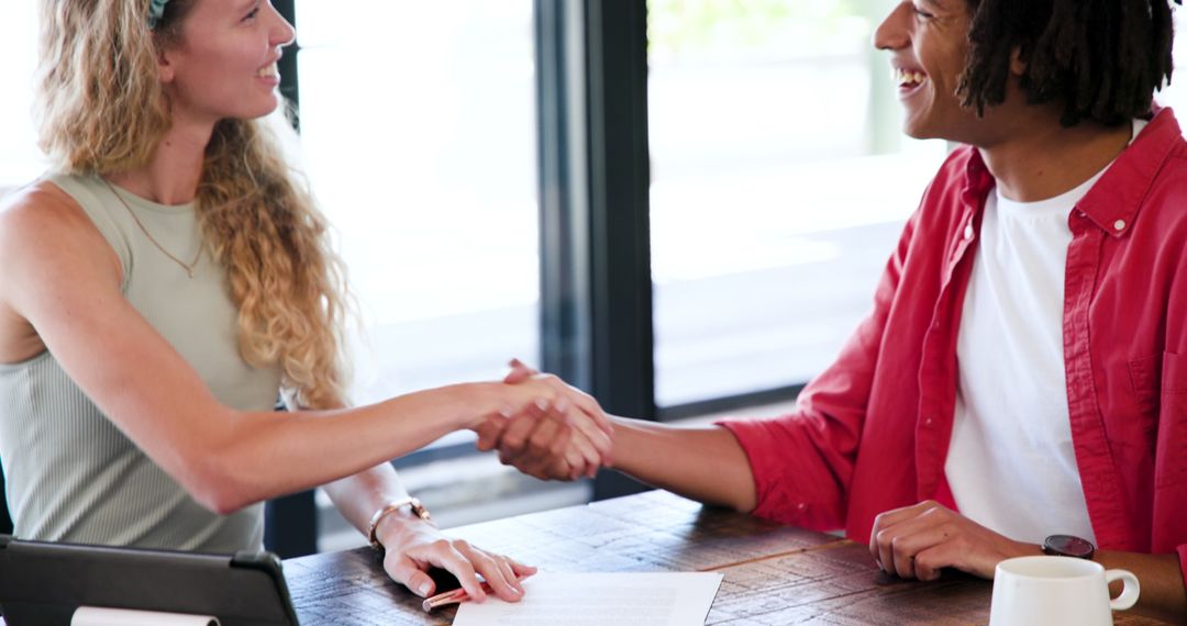 Successful Business Meeting with Smiling Colleagues Shaking Hands