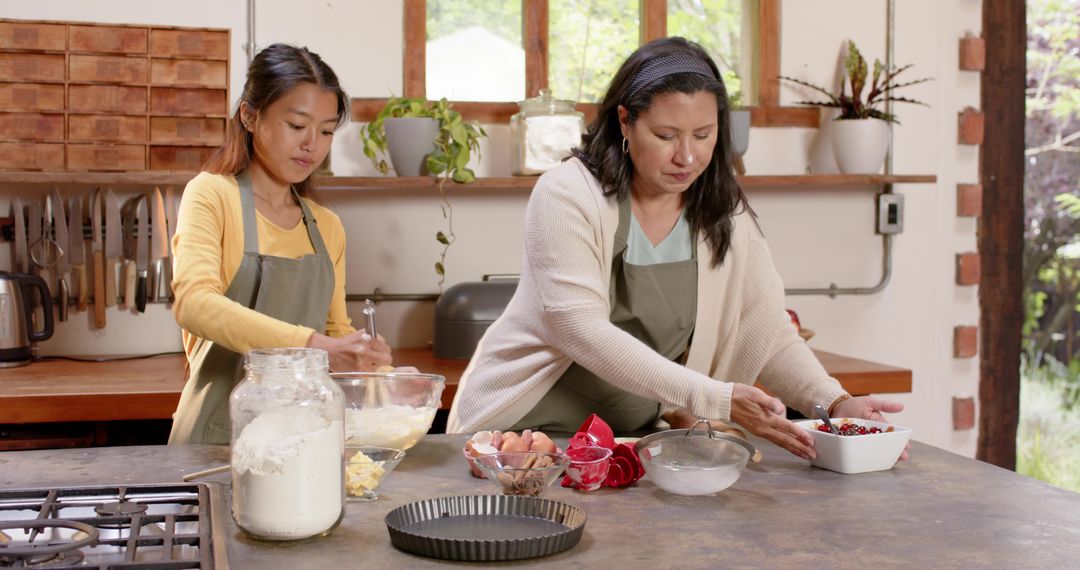 Mother and Daughter Cooking Together in Rustic Kitchen