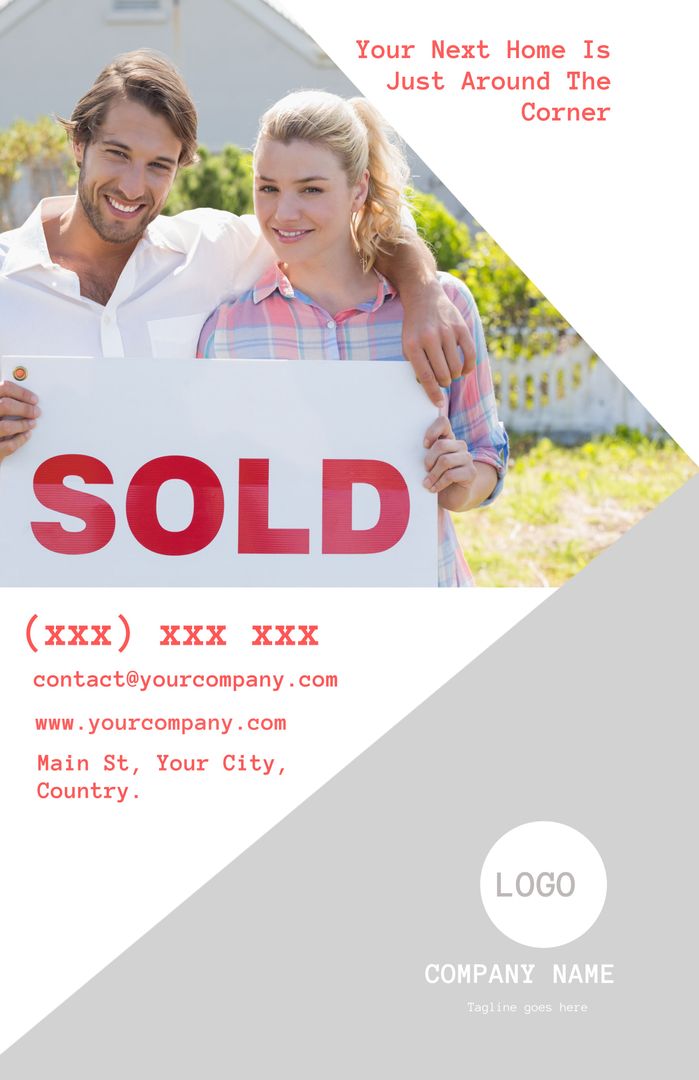 Couple Celebrating Home Purchase with Sold Sign