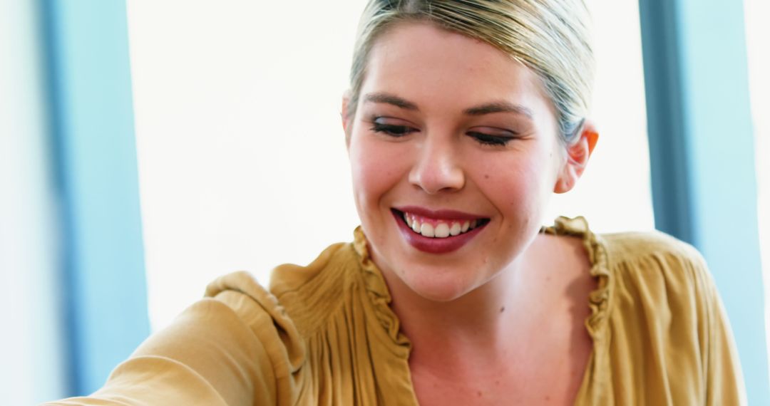 Smiling Young Woman Wearing Gold Top - Free Images, Stock Photos and Pictures on Pikwizard.com