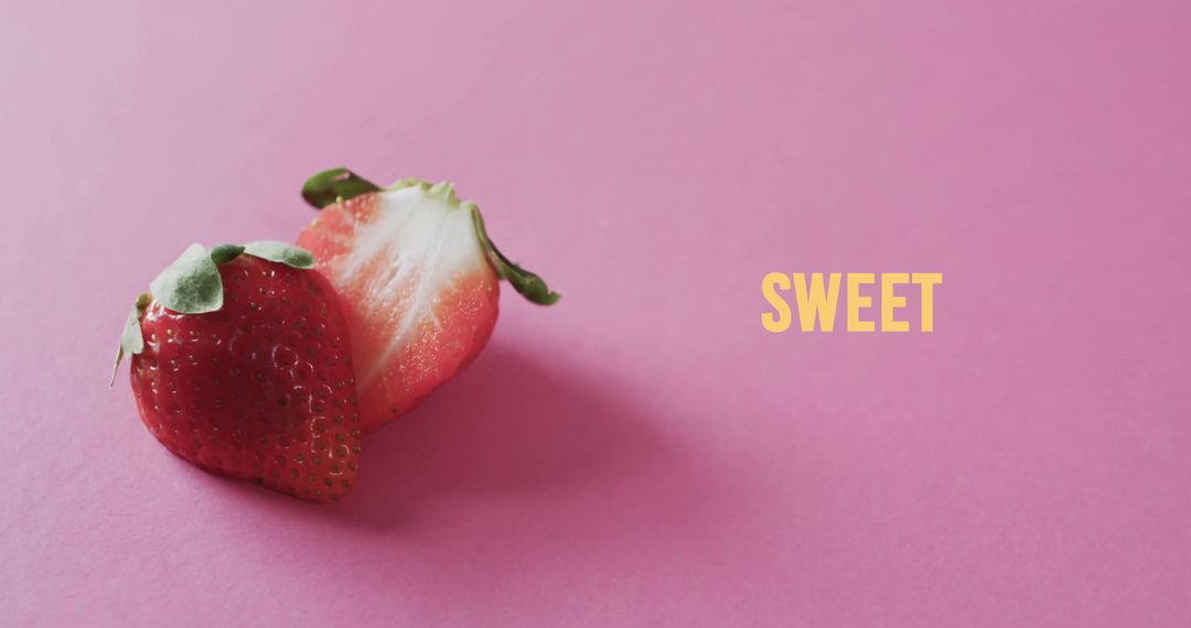 Halved Strawberries on Pink Background with Sweet Text