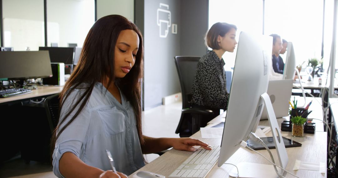 Focused Business Professionals Working at Office Desks