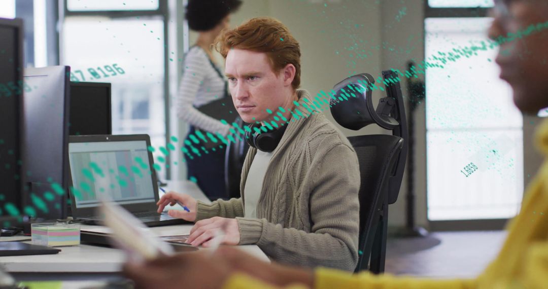 Diverse Team Engaged in Data Analysis and Digital Interface Work