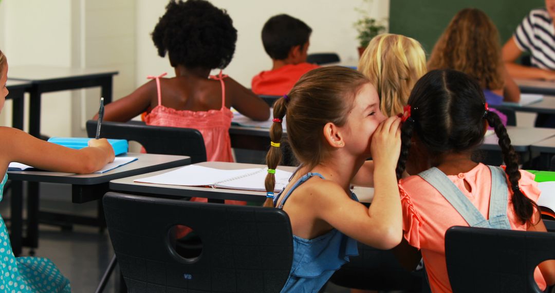 Whispering Schoolgirls Sharing Secrets in Class