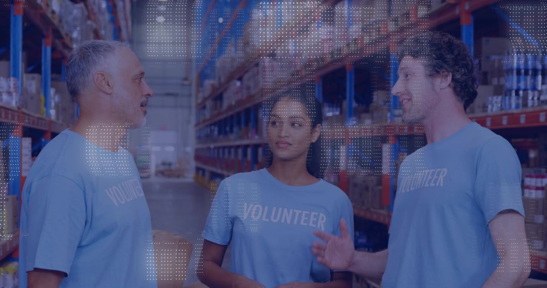 Volunteer Team Discussing Distribution Logistics in Warehouse Aisle