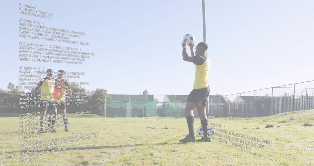 Goalkeeper holding soccer ball training on sunny community field with code overlay