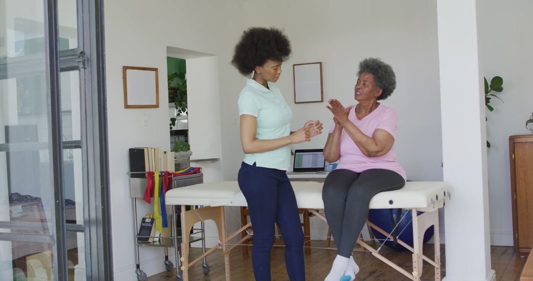 Female Physiotherapist Assisting Senior Woman with Physical Therapy at Home - Free Images, Stock Photos and Pictures on Pikwizard.com