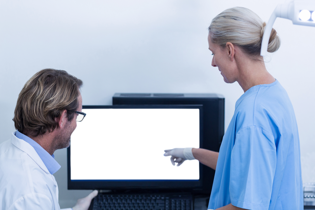 Dentists Reviewing Digital X-Ray on Monitor with Transparent Display - Download Free Stock Images Pikwizard.com