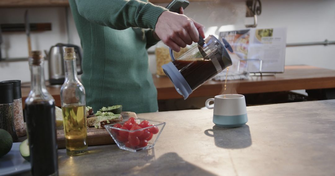 Person Using French Press to Pour Fresh Coffee in Modern Kitchen - Free Images, Stock Photos and Pictures on Pikwizard.com