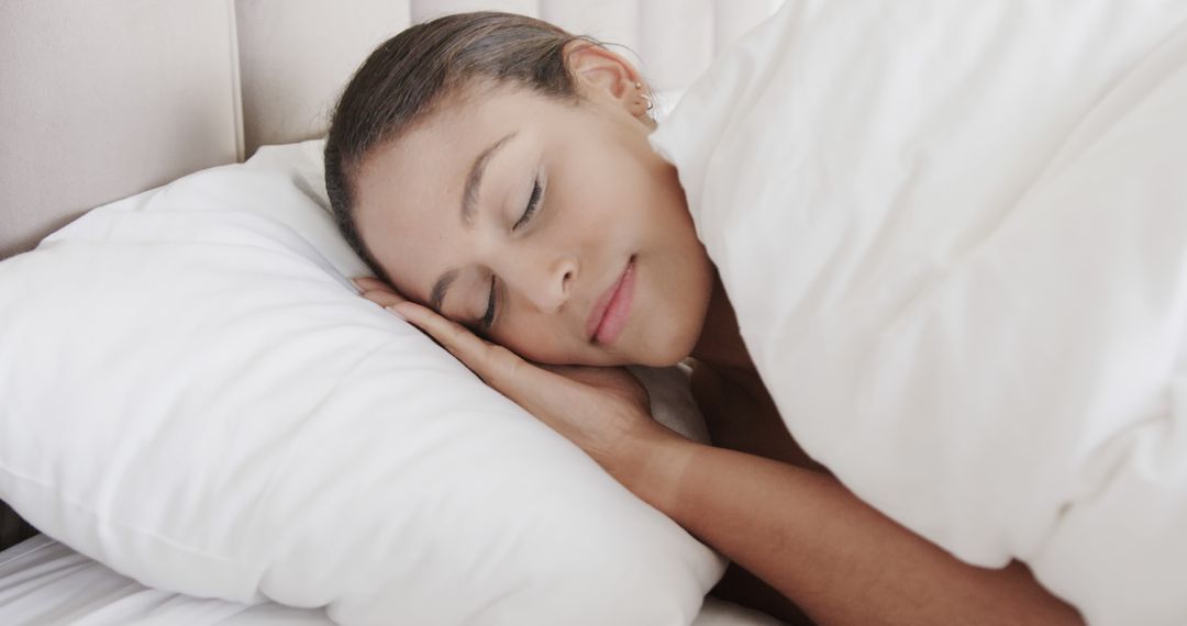 Peaceful Woman Sleeping in Bed with White Bedding - Free Images, Stock Photos and Pictures on Pikwizard.com