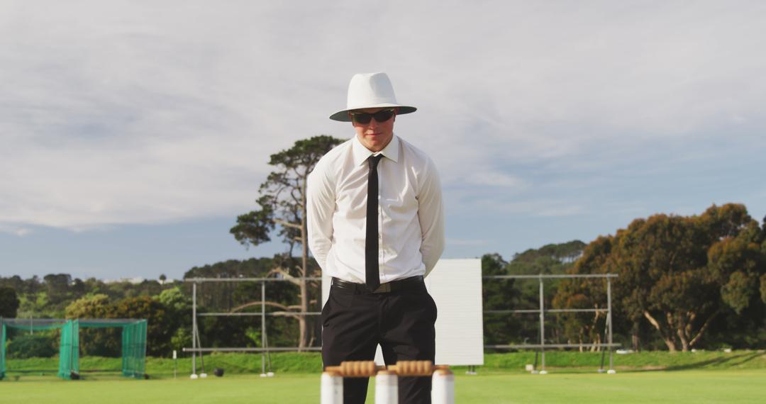 Cricket Umpire Observing Wickets on Sunny Day - Free Images, Stock Photos and Pictures on Pikwizard.com