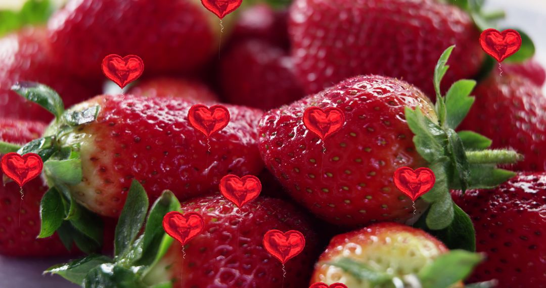 Strawberries with Falling Heart Balloons Symbolizing Love and Freshness