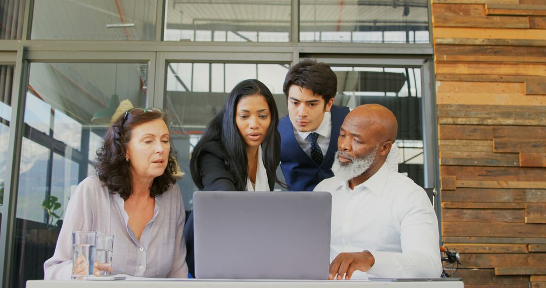 Diverse Business Team Collaborating on Project at Office
