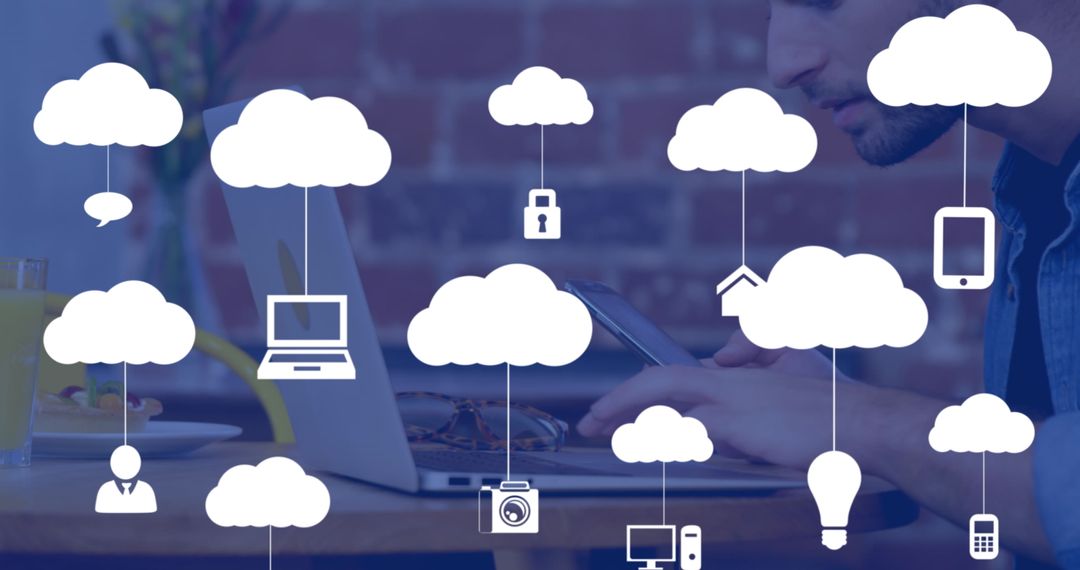 Freelancer in Cafe Using Tablet with Cloud Icons Overlay