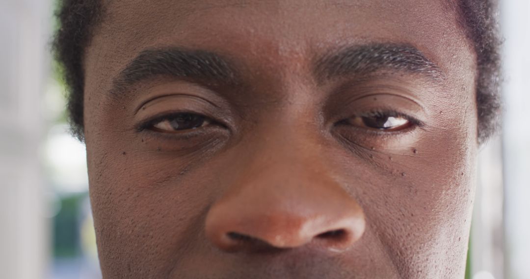 Close-up of a Thoughtful African American Man with Focused Eyes - Free Images, Stock Photos and Pictures on Pikwizard.com